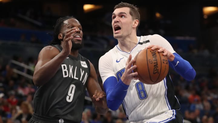 Mar 28, 2018; Orlando, FL, USA; Orlando Magic forward Mario Hezonja (8) drives to the basket as Brooklyn Nets forward DeMarre Carroll (9) defends during the first quarter at Amway Center. 