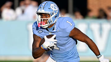 Sep 7, 2024; Chapel Hill, North Carolina, USA; North Carolina Tar Heels wide receiver Jordan Shipp (1)  with the ball in the fourth quarter at Kenan Memorial Stadium. Mandatory Credit: Bob Donnan-Imagn Images