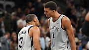 Nov 7, 2025; San Antonio, Texas, USA; San Antonio Spurs forward Victor Wembanyama (1) and San Antonio Spurs forward Keldon Johnson (3) react after gaining the lead at the end of the second quarter against the Houston Rockets at Frost Bank Center.