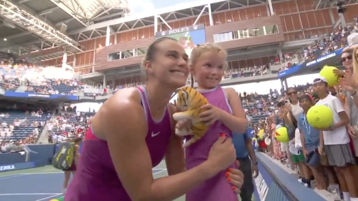 Aryna Sabalenka poses with a little girl dressed like her at the 2024 U.S. Open.