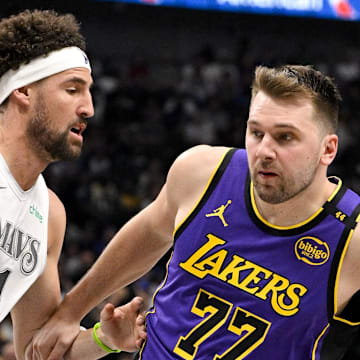 Dallas Mavericks guard Klay Thompson and Los Angeles Lakers guard Luka Doncic in action during the game between the Dallas Mavericks and the Los Angeles Lakers at American Airlines Center. Mandatory Credit: Jerome Miron-Imagn Images