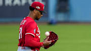 Cincinnati Reds starting pitcher Hunter Greene (21) wraps up before the first inning of the MLB National League Wild Card Game 1 between the Los Angeles Dodgers and the Cincinnati Reds at Dodger Stadium in Los Angeles on Tuesday, Sept. 30, 2025. The Dodgers won game 1 of the series, 10-5.