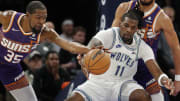 Apr 14, 2024; Minneapolis, Minnesota, USA; Phoenix Suns forward Kevin Durant (35) reaches for the