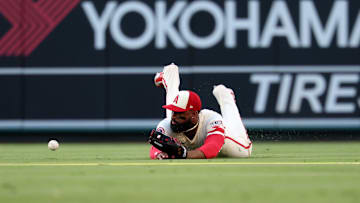 Jul 29, 2025; Anaheim, California, USA;  Los Angeles Angels center fielder Jo Adell (7) is unable to handle a ball hit for a single by Texas Rangers left fielder Sam Haggerty (0, not pictured) during the first inning at Angel Stadium. Mandatory Credit: Kiyoshi Mio-Imagn Images