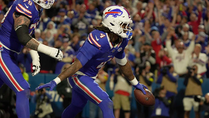Buffalo Bills running back James Cook celebrates his touchdown run with teammate offensive tackle Spencer Brown during the second half of their game against the Baltimore Ravens at Highmark Stadium in Orchard Park on Sept. 7, 2025.