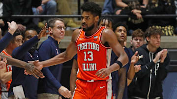Illinois Fighting Illini forward Quincy Guerrier (13) high-five the Illinois bench after drawing a