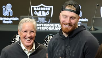 Pete Carroll with Maxx Crosby.