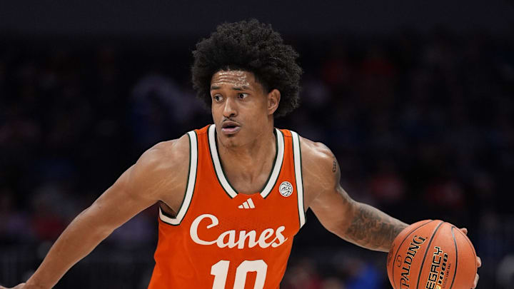 Mar 13, 2026; Charlotte, NC, USA; Miami Hurricanes guard Tru Washington (10) dribbles the ball during the second half against the Virginia Cavaliers at Spectrum Center. Mandatory Credit: Jim Dedmon-Imagn Images