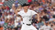 Jul 1, 2025; Denver, Colorado, USA; Colorado Rockies pitcher Jimmy Herget (44) delivers a pitch in the fourth inning against the Houston Astros at Coors Field. Mandatory Credit: Ron Chenoy-Imagn Images