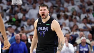 May 24, 2024; Minneapolis, Minnesota, USA; Dallas Mavericks guard Luka Doncic (77) reacts in the fourth quarter against the Minnesota Timberwolves during game two of the western conference finals for the 2024 NBA playoffs at Target Center. Mandatory Credit: Jesse Johnson-USA TODAY Sports