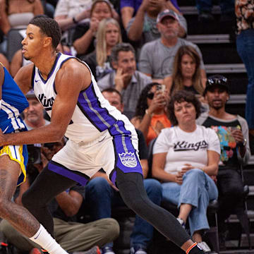 Oct 9, 2024; Sacramento, California, USA; Sacramento Kings forward Keegan Murray (13) defends against Golden State Warriors forward Jonathan Kuminga (00) during the first quarter at Golden 1 Center. Mandatory Credit: Ed Szczepanski-Imagn Images