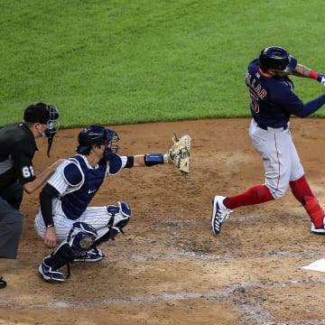 Jul 31, 2020; Bronx, New York, USA;  Boston Red Sox right fielder Kevin Pillar (23) hits a single in the third inning against the New York Yankees at Yankee Stadium. Mandatory Credit: Wendell Cruz-USA TODAY Sports