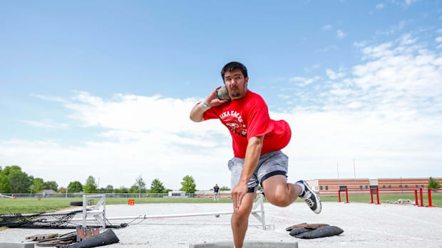 Jackson Cantwell throwing a shotput