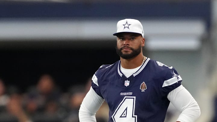 Dak Prescott watching from the sideline