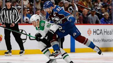 Apr 23, 2025; Denver, Colorado, USA; Colorado Avalanche left wing Gabriel Landeskog (92) checks Dallas Stars right wing Mikko Rantanen (96) in the first period in game three of the first round of the 2025 Stanley Cup Playoffs at Ball Arena. Mandatory Credit: Isaiah J. Downing-Imagn Images