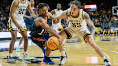 Christian Tucker tries to elude Wichita State defender