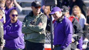 Nov 6, 2021; Lawrence, Kansas, USA; Kansas Jayhawks head coach Lance Leipold (left) talks with Kansas State Wildcats head coach Chris Klieman during an injury time out during the first half at David Booth Kansas Memorial Stadium. Mandatory Credit: Denny Medley-Imagn Images