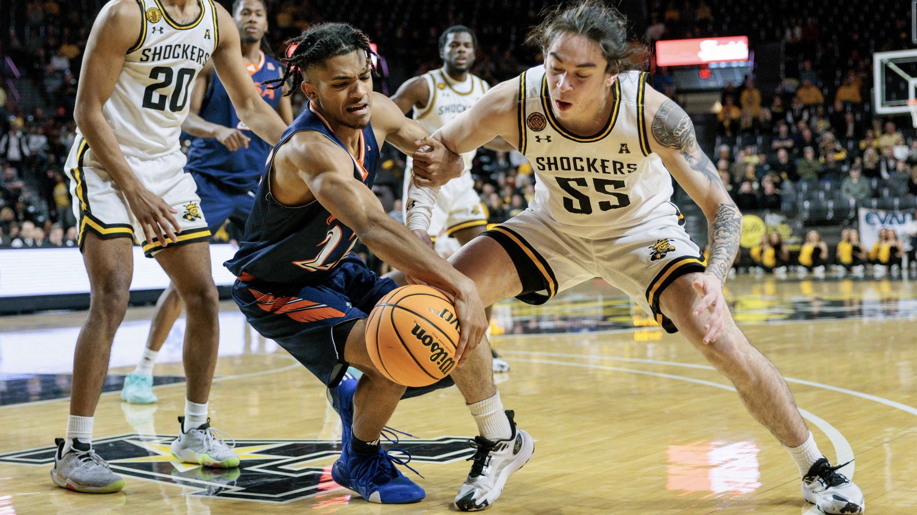 Christian Tucker tries to elude Wichita State defender