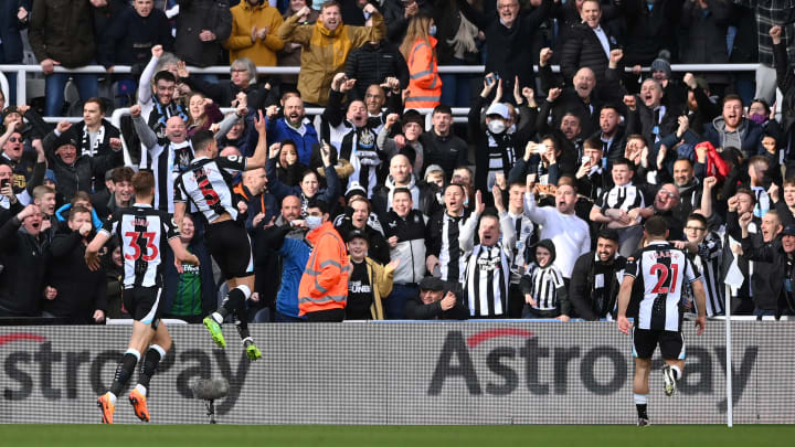Newcastle United's fans and players celebrate Fabian Schar's second goal against Brighton