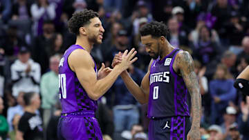 Dec 3, 2024; Sacramento, California, USA; Sacramento Kings guard Malik Monk (0) is congratulated by guard Colby Jones (20) during the fourth quarter against the Houston Rockets at Golden 1 Center. Mandatory Credit: Sergio Estrada-Imagn Images