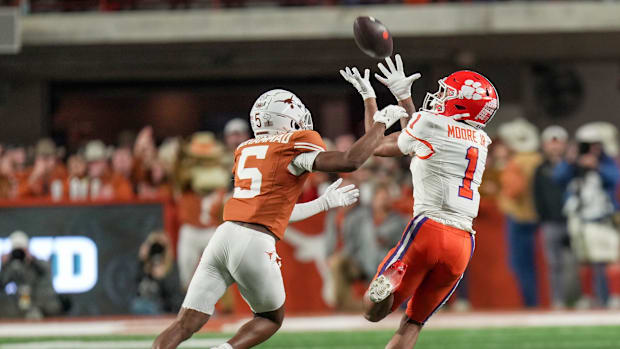 Clemson Tigers wide receiver T.J. Moore (1) catches the ball for a first down against Texas Longhorns defensive back Malik Mu