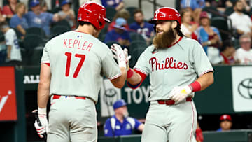 Aug 8, 2025; Arlington, Texas; Philadelphia Phillies center fielder Brandon Marsh (16) celebrates with Philadelphia Phillies left fielder Max Kepler (17) after hitting a home run during the fourth inning against the Texas Rangers at Globe Life Field. 