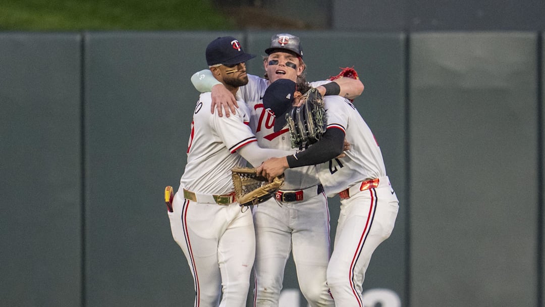 Jul 9, 2025; Minneapolis, Minnesota, USA; Minnesota Twins left fielder Willi Castro (50), center fielder Harrison Bader (12), and right fielder DaShawn Keirsey Jr. (21) celebrate after defeating the Chicago Cubs at Target Field. Mandatory Credit: Jesse Johnson-Imagn Images