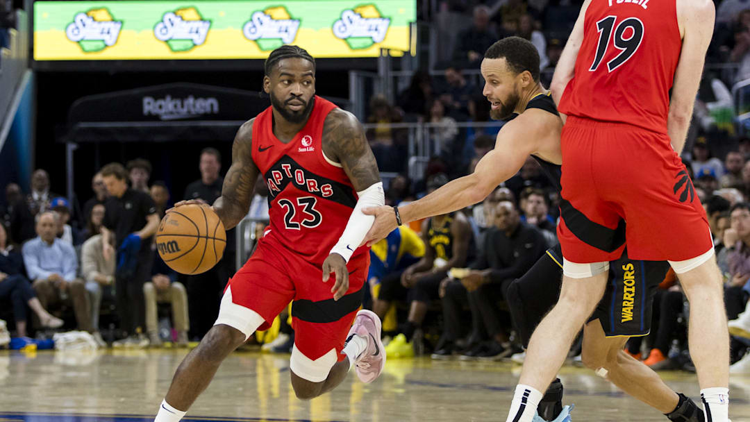 Mar 20, 2025; San Francisco, California, USA; Toronto Raptors guard Jamal Shead (23) drives down the court against the Golden State Warriors during the third quarter at Chase Center. Mandatory Credit: John Hefti-Imagn Images