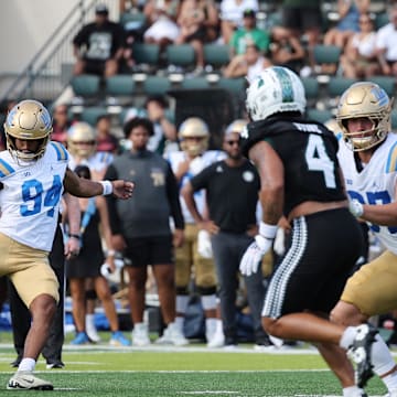 Aug 31, 2024; Honolulu, Hawaii, USA; UCLA Bruins place kicker Mateen Bhaghani (94) makes a field goal against the Hawaii Rainbow Warriors during the third quarter of an NCAA college football game against the UCLA Bruins at the Clarence T.C. Ching Athletics Complex. Mandatory Credit: Marco Garcia-Imagn Images