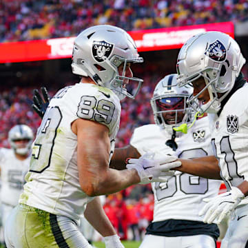 Nov 29, 2024; Kansas City, Missouri, USA; Las Vegas Raiders tight end Brock Bowers (89) celebrates with wide receiver Tre Tucker (11) after scoring against the Kansas City Chiefs during the second half at GEHA Field at Arrowhead Stadium. Mandatory Credit: Denny Medley-Imagn Images