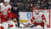 Jan 2, 2025; Columbus, Ohio, USA; Columbus Blue Jackets left wing Dmitri Voronkov (10) tips a puck on goal against the Detroit Red Wings during the first period at Nationwide Arena. Mandatory Credit: Russell LaBounty-Imagn Images