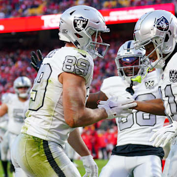 Nov 29, 2024; Kansas City, Missouri, USA; Las Vegas Raiders tight end Brock Bowers (89) celebrates with wide receiver Tre Tucker (11) after scoring against the Kansas City Chiefs during the second half at GEHA Field at Arrowhead Stadium. Mandatory Credit: Denny Medley-Imagn Images