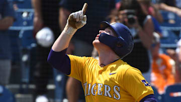 May 26 2024; Hoover, AL, USA; LSU batter Jared Jones (22) gestures heavenward as he enjoys his home run trot after hitting a solo shot to left against Tennessee at the Hoover Met during the championship game of the SEC Tournament.