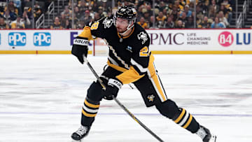 Oct 29, 2024; Pittsburgh, Pennsylvania, USA;  Pittsburgh Penguins defenseman Marcus Pettersson (28) shots the puck against the Minnesota Wild during the second period at PPG Paints Arena. Mandatory Credit: Charles LeClaire-Imagn Images