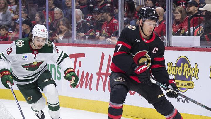 Apr 4, 2026; Ottawa, Ontario, CAN; Ottawa Senators left wing Brady Tkachuk (7) moves the puck as Minnesota Wild defenseman Quinn Hughes (43) follows in the first period at the Canadian Tire Centre. Mandatory Credit: Marc DesRosiers-IMAGN Images