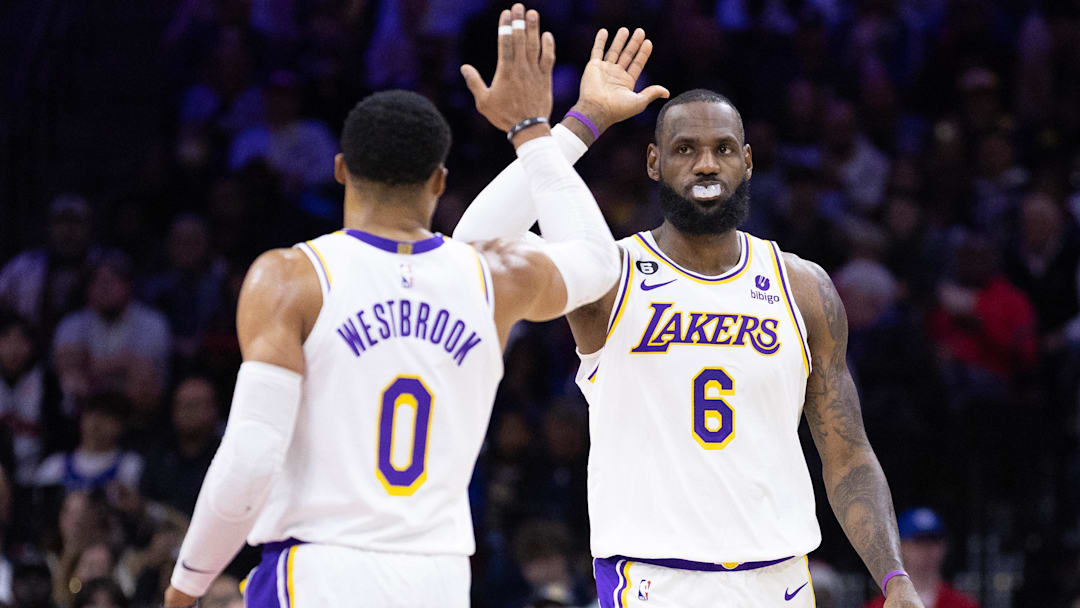 Los Angeles Lakers forward LeBron James (6) and  former guard Russell Westbrook (0) high-five after a score against the Philadelphia 76ers during the second quarter at Wells Fargo Center.