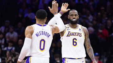 Los Angeles Lakers forward LeBron James (6) and  former guard Russell Westbrook (0) high-five after a score against the Philadelphia 76ers during the second quarter at Wells Fargo Center.