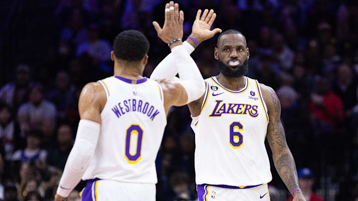 Los Angeles Lakers forward LeBron James (6) and  former guard Russell Westbrook (0) high-five after a score against the Philadelphia 76ers during the second quarter at Wells Fargo Center.