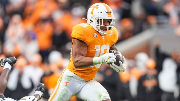 Tennessee running back DeSean Bishop (18) outruns Vanderbilt safety CJ Heard (8) and Vanderbilt cornerback Martel Hight (4) during a NCAA football game between Tennessee and Vanderbilt at Neyland Stadium in Knoxville, Tenn., on Nov. 29, 2025.