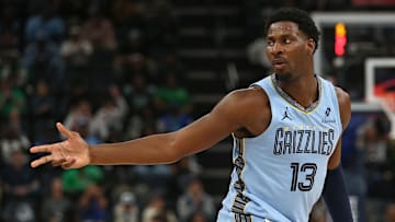 Mar 31, 2025; Memphis, Tennessee, USA; Memphis Grizzlies forward Jaren Jackson Jr. (13) reacts after a 3-point basket during the third quarter against the Boston Celtics at FedExForum.