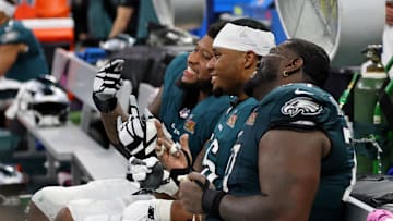 Feb 9, 2025; New Orleans, LA, USA; Philadelphia Eagles offensive tackle Fred Johnson (left) and guard Tyler Steen (center) react on the bench during the second half of Super Bowl LIX at Caesars Superdome. Mandatory Credit: Geoff Burke-Imagn Images