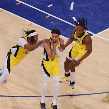 May 21, 2025; New York, New York, USA; Indiana Pacers guard Tyrese Haliburton (0) celebrates with teammates after tying the game in the fourth quarter to send the game to overtime against the New York Knicks during game one of the eastern conference finals for the 2025 NBA Playoffs at Madison Square Garden. Mandatory Credit: Brad Penner-Imagn Images