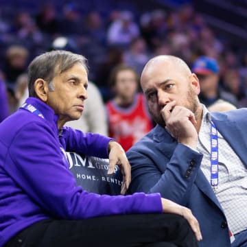 Dec 13, 2022; Philadelphia, Pennsylvania, USA; Sacramento Kings owner Vivek Ranadive (L) and general manager Monte McNair (R) talk during warm ups before a game against the Philadelphia 76ers at Wells Fargo Center. Mandatory Credit: Bill Streicher-USA TODAY Sports