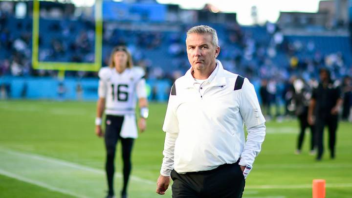 Dec 12, 2021; Nashville, Tennessee, USA;  Jacksonville Jaguars head coach Urban Meyer walks from the field after the game as quarterback Trevor Lawrence (16) follows against the Tennessee Titans at Nissan Stadium.