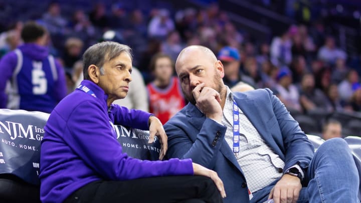 Dec 13, 2022; Philadelphia, Pennsylvania, USA; Sacramento Kings owner Vivek Ranadive (L) and general manager Monte McNair (R) talk during warm ups before a game against the Philadelphia 76ers at Wells Fargo Center. Mandatory Credit: Bill Streicher-USA TODAY Sports