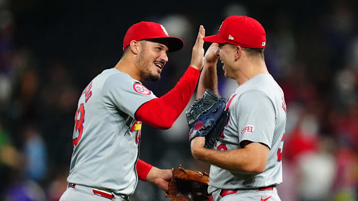 Sep 25, 2024; Denver, Colorado, USA; St. Louis Cardinals third base Nolan Arenado (28) and relief pitcher Ryan Helsley (56) celebrate defeating the Colorado Rockies at Coors Field. Mandatory Credit: Ron Chenoy-Imagn Images