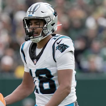 Carolina Panthers wide receiver Jalen Coker (18) grabs a beach ball; that blew onto the field during the second quarter of their game against the Green Bay Packers Sunday, November 2, 2025 at Lambeau Field in Green Bay, Wisconsin.