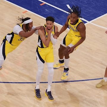 Indiana Pacers guard Tyrese Haliburton (0) celebrates with teammates after tying the game in the fourth quarter to send the game to overtime against the New York Knicks during game one of the eastern conference finals for the 2025 NBA Playoffs at Madison Square Garden. Mandatory Credit: Brad Penner-Imagn Images