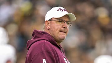 Nov 8, 2025; Columbia, Missouri, USA; Texas A&M Aggies head coach Mike Elko watches warmups prior to a game against the Missouri Tigers at Faurot Field at Memorial Stadium. Mandatory Credit: Jay Biggerstaff-Imagn Images