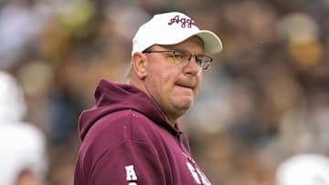 Nov 8, 2025; Columbia, Missouri, USA; Texas A&M Aggies head coach Mike Elko watches warmups prior to a game against the Missouri Tigers at Faurot Field at Memorial Stadium. Mandatory Credit: Jay Biggerstaff-Imagn Images